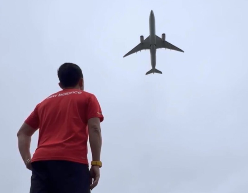 Looking up at a plane passing overhead